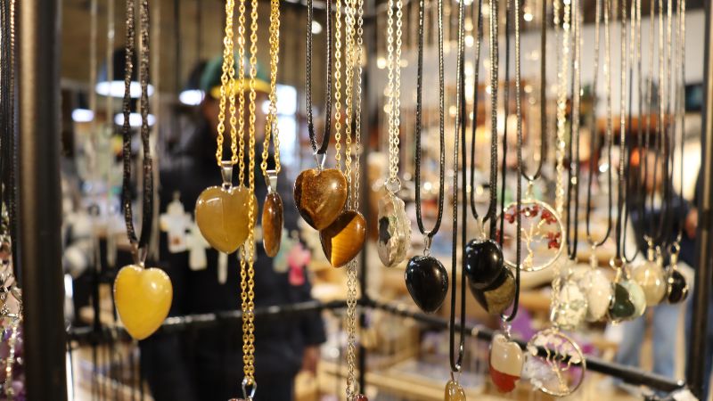 Necklaces hanging on a rack at Gilbert Stone's.